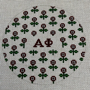 Alpha Phi - Round w/allover flowers and greek letters